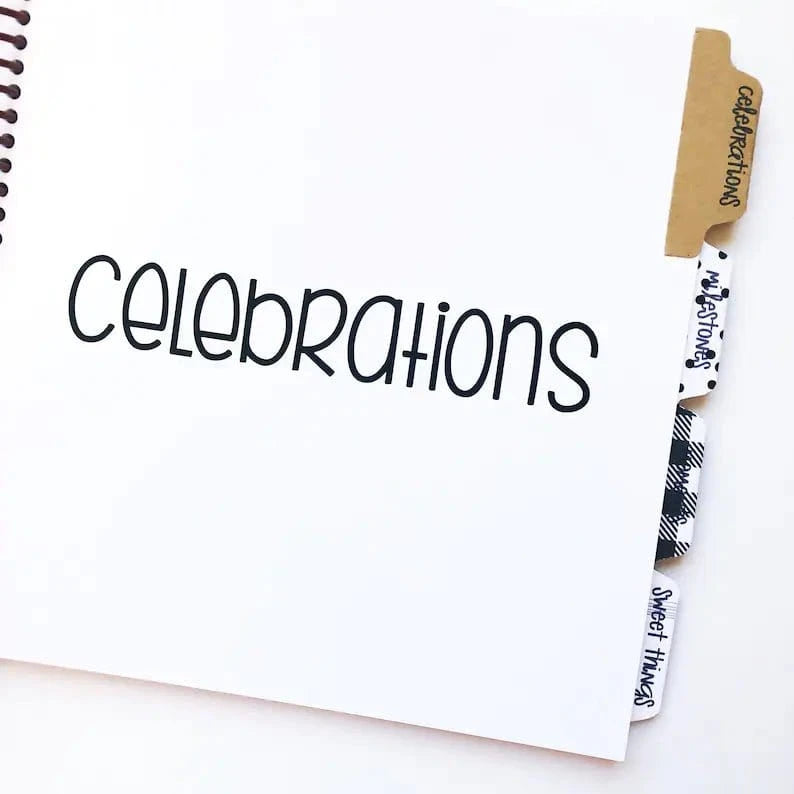 Baby book has tabbed divider pages, organized by celebrations, milestones, moments and sweet things.