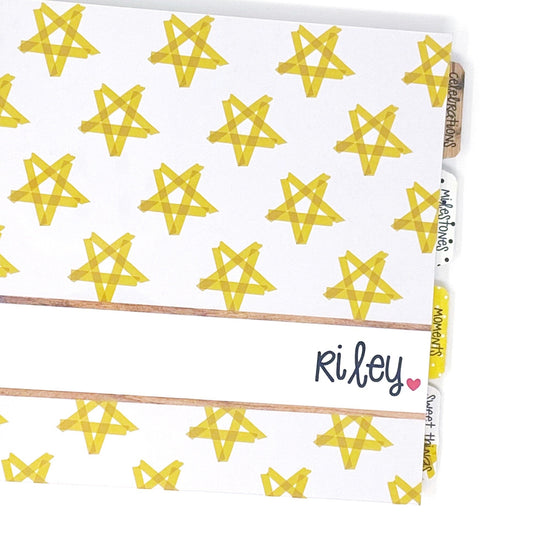 foster child memory book. Front cover is white with yellow stars
